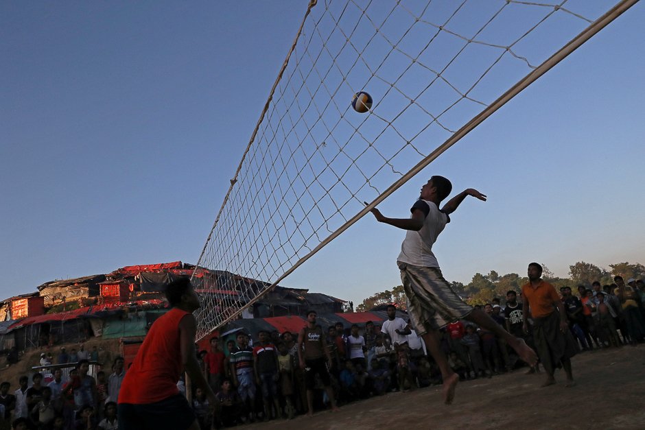 Rohingya refugees play volleyball in a makeshift refugee camp in Cox's Bazar, Bangladesh. PHOTO: REUTERS