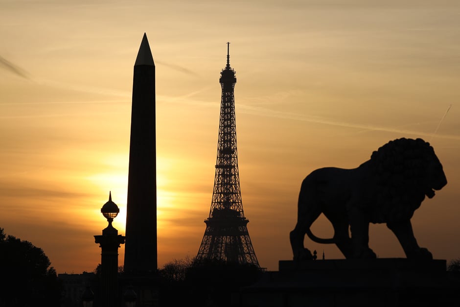 A picture taken at sunset on on the place de la Concorde in Paris shows the Eiffel tower and the obelisque monument. PHOTO: AFPg