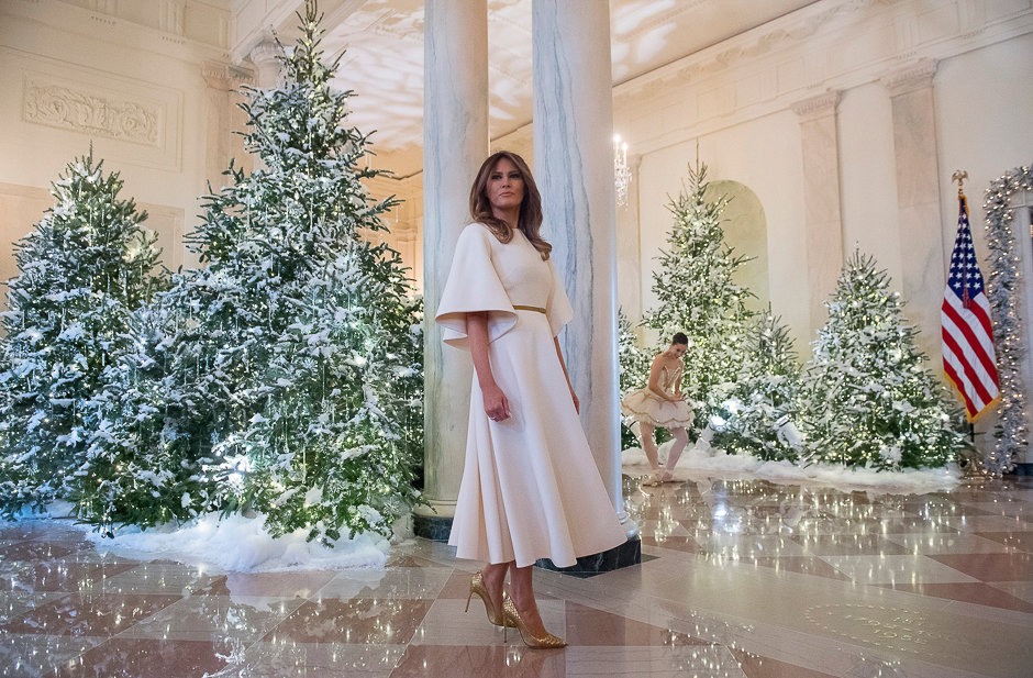 US First Lady Melania Trump stands in the Grand Foyer as she tours Christmas decorations at the White House in Washington, DC. PHOTO: AFP