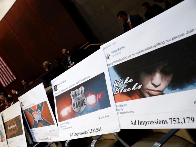 Examples of Facebook pages are seen, as executives appear before the House Intelligence Committee to answer questions related to Russian use of social media to influence U.S. elections, on Capitol Hill in Washington, U.S., November 1, 2017. PHOTO: REUTERS