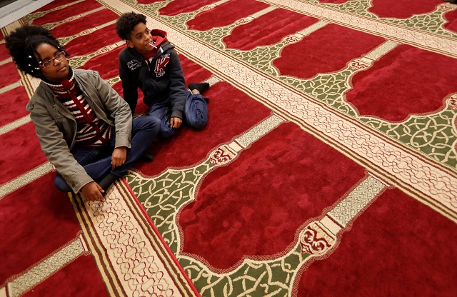 two boys part of a group of hungarians visiting a mosque to learn about the muslim community in budapest look on budapest hungary november 3 2017 photo reuters