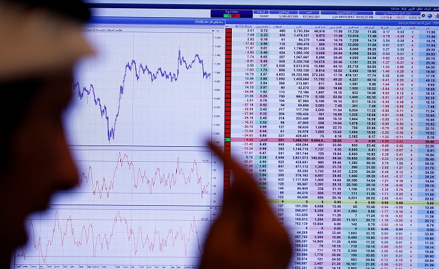 an investor gestures as he monitors a screen displaying stock information in riyadh saudi arabia november 6 2017 photo reuters