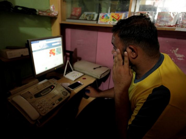 A man explores social media on a computer at an internet club in Islamabad, Pakistan.
PHOTO: REUTERS