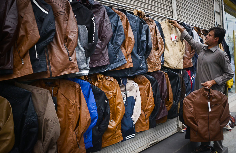 A vendor displays leather jackets to attract the customers as winter arrives in Lahore, Pakistan. PHOTO: ONLINEr