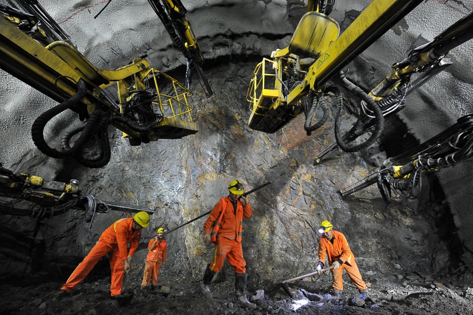 Workers are seen in a tunnel for the Beijing-Zhangjiakou high speed railway under construction in Beijing, China. PHOTO: REUTERS