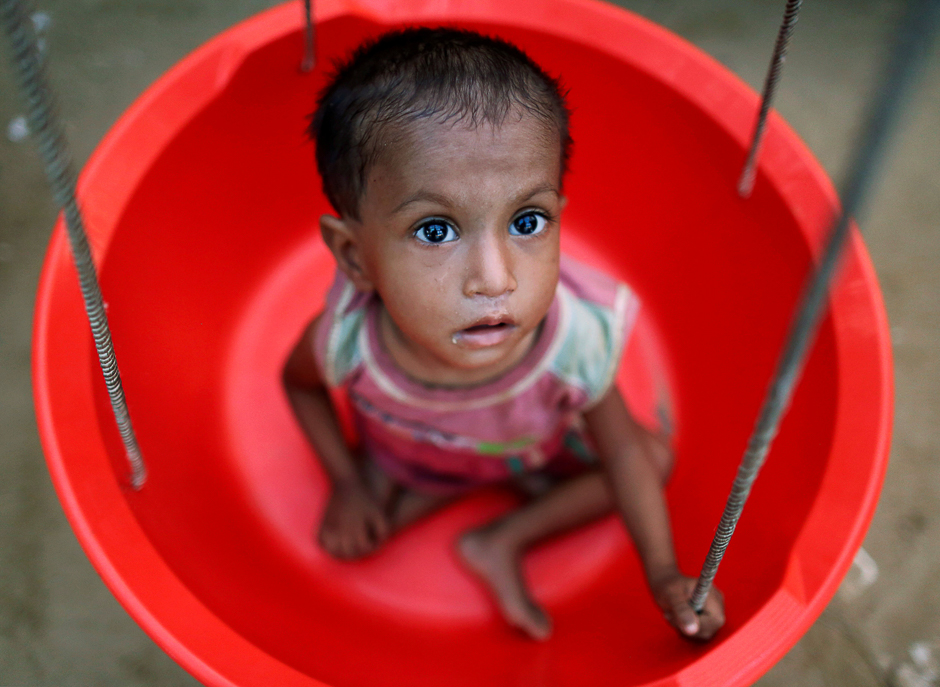 A Rohingya refugee girl is weighed at the emergency nutrition treatment centre in Balukhali refugee camp near Cox's Bazar, Bangladesh. PHOTO: REUTERS