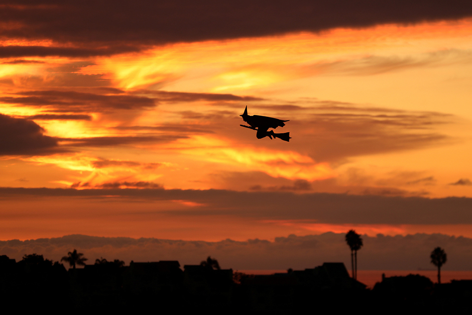 A remote controlled witch on a broom flies over a Southern California neighborhood after sunset on Halloween night in Encinitas, California, US. PHOTO: REUTERS