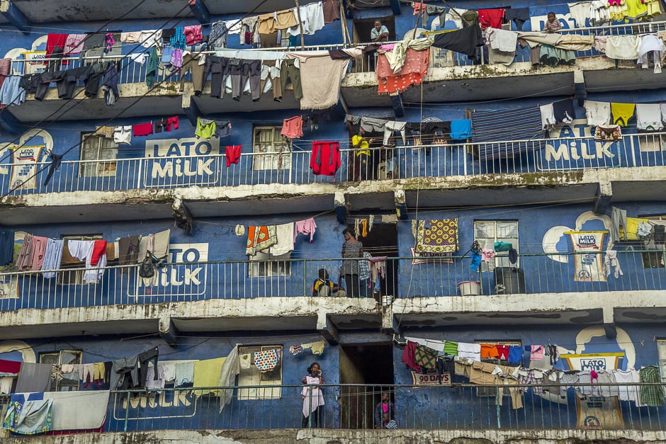 People stand on their balcony, in the Mathare slums of Nairobi, a stronghold of Kenyan opposition leader. PHOTO: AFP