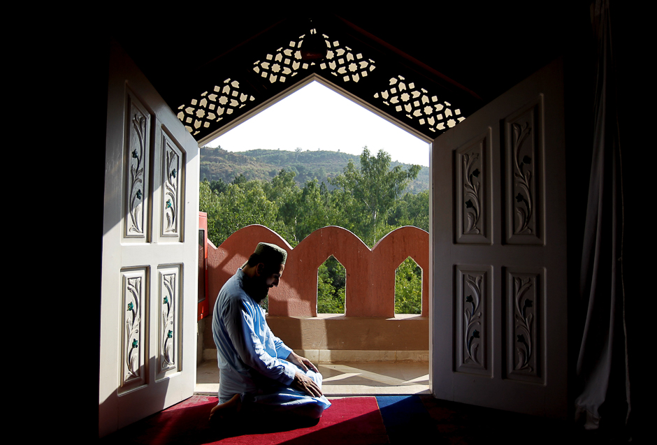 A man prays at the Al-Nadwa Madrassa in Murree, Pakistan. PHOTO: REUTERS