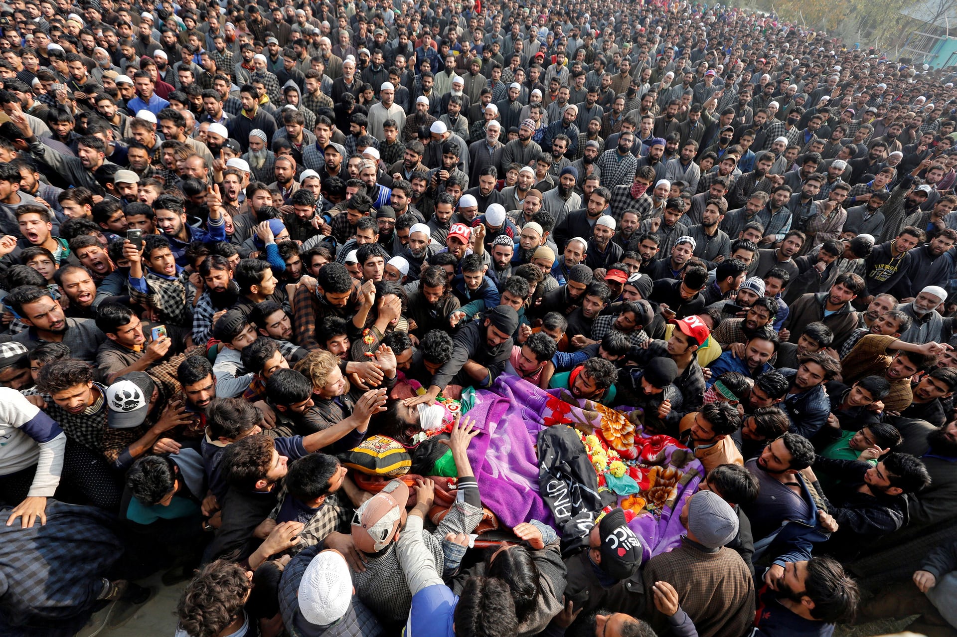 Mourners carry the body of Waseem Ahmad, a suspected militant, who was killed in a gun battle with Indian security forces, Drubgam, Kashmir. PHOTO: REUTERS