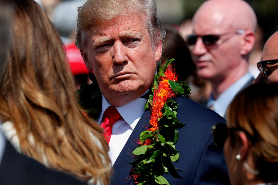 US President Donald Trump sports a flower lei he was given as he and first lady Melania Trump arrive aboard Air Force One at Hickam Air Force Base, Hawaii, US. PHOTO: REUTERS