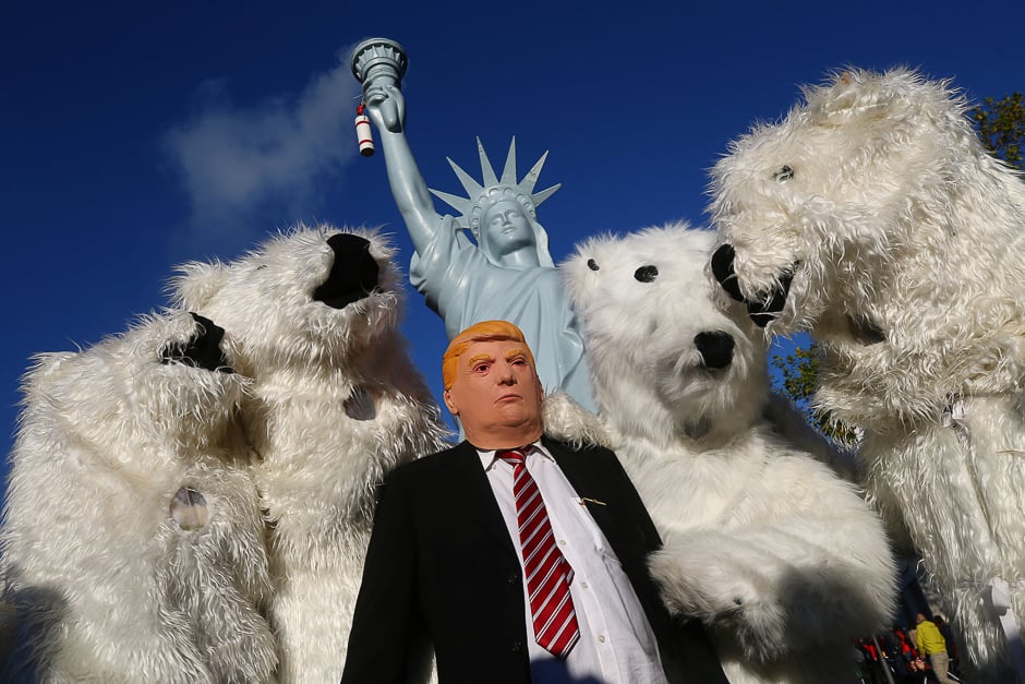 A protester wearing a mask of US President Donald Trump stands along with other protesters dressed as polar bears before the start of the COP 23 UN Climate Change Conference hosted by Fiji but held in Bonn, Germany. PHOTO: REUTERS