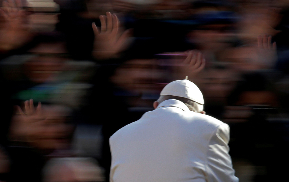 Pope Francis waves as he arrives to lead the Wednesday general audience in Saint Peter's square at the Vatican. PHOTO: REUTERS