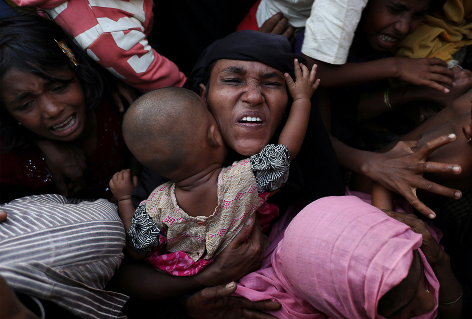 Rohingya refugees scuffle as they wait to receive relief aid at Kutupalong refugee camp, near Cox's Bazar, Bangladesh. PHOTO: REUTERS