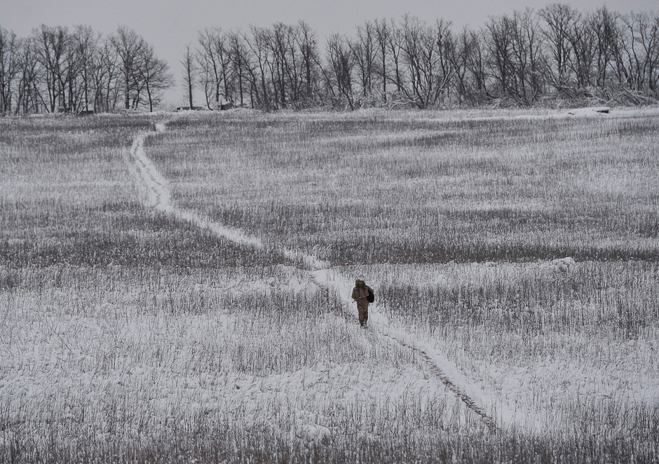 A Ukrainian serviceman is seen as he walks near the government-held village of Travneve, Ukraine. PHOTO: REUTERS