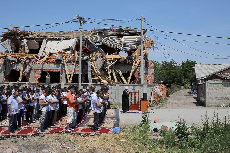 Muslims pray on a street in front of an illegally built mosque which was destroyed in the district of Zemun Polje in Belgrade, Serbia. PHOTO: REUTERS