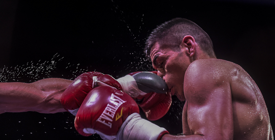 Argentinian Fabian Maidana absorbs a blow from Venezuelean Johan Perez during their welterweight boxing match at the Macarena Event Centre in Medellin. PHOTO: AFP