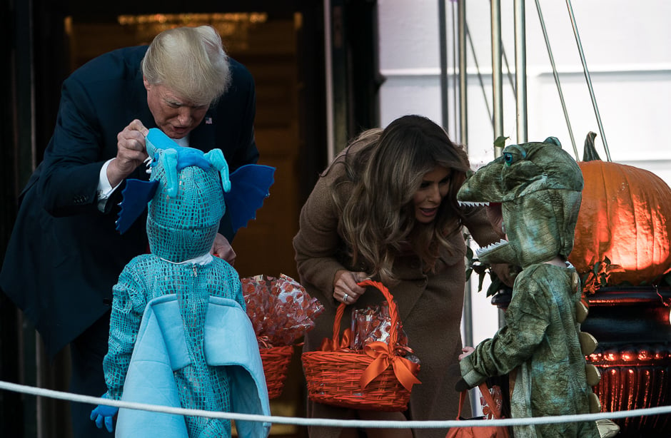 US President Donald Trump and First Lady Melania Trump hand out candy to children during a Halloween event at the White House in Washington, DC. PHOTO: AFP