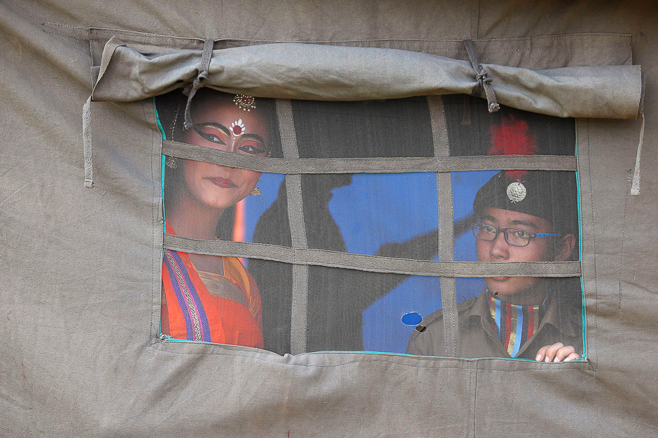 Members of the National Cadet Corps (NCC) look out from a tent as they wait to take part in the celebrations marking the 69th anniversary of the creation of the NCC, in Kolkata, India. PHOTO: REUTERS