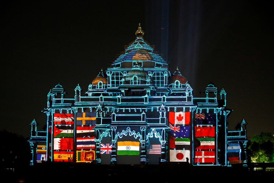 The Akshardham temple is illuminated during a laser light show to celebrate the temple's silver jubilee in Gandhinagar, India. PHOTO: REUTERS