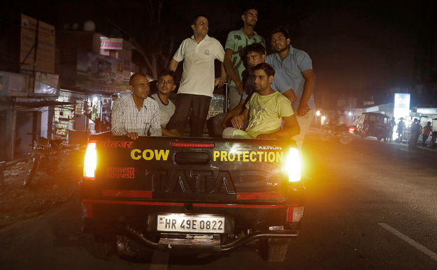 ON PATROL: A group of cow vigilantes prepare to set up a roadblock, accompanied by police, near the northern Indian city of Chandigarh in early July. PHOTO: REUTERS