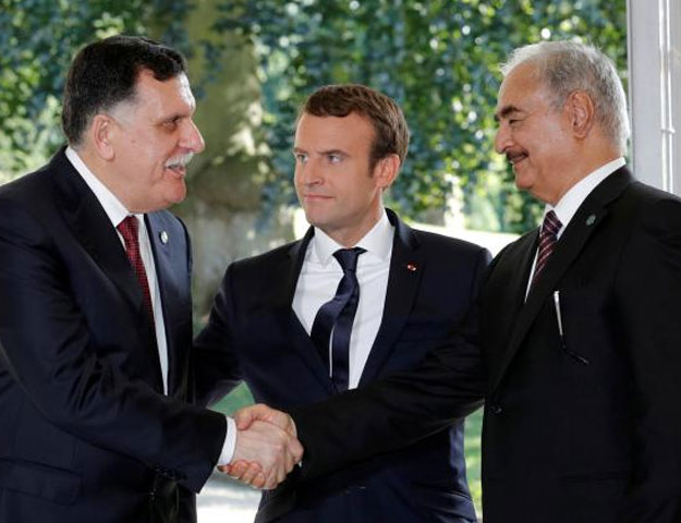 French President with Libyan Prime Minister Fayez al-Sarraj (L), and General Khalifa Haftar (R), commander in the Libyan National Army (Reuters ) 