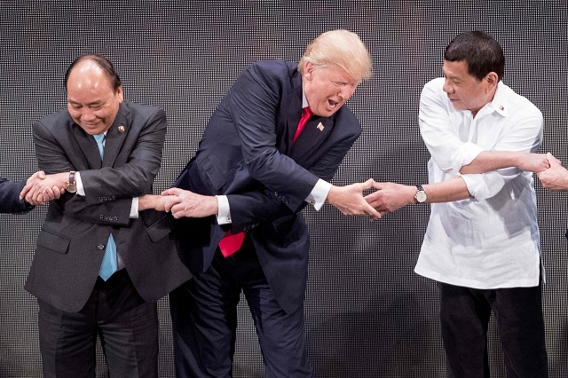 After an awkward few seconds, Trump appeared to recognise his error and made the link between Nguyen and Duterte. PHOTO: AFP