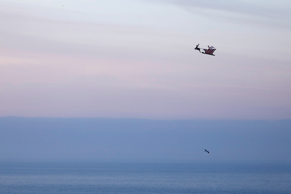 A 10-foot long remote controlled flying Santa makes a test flight over the ocean in Carlsbad, California, US. PHOTO: REUTERS