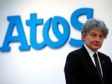 file-photo-atos-chairman-and-ceo-thierry-breton-poses-in-front-of-the-companys-logo-during-a-presentationin-paris