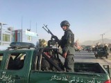 an-afghan-policeman-stands-at-the-site-of-a-blast-in-kabul-afghanistan-2-3
