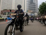 mobile-brigade-policemen-on-motorbikes-ride-through-the-business-district-ahead-of-the-christmas-and-new-year-celebrations-in-jakarta