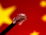 file-photo-illustration-photo-of-a-computer-network-cable-above-a-chinese-flag-2