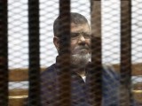 file-photo-of-deposed-egyptian-president-mursi-listening-to-his-verdict-behind-bars-at-a-court-on-the-outskirts-of-cairo