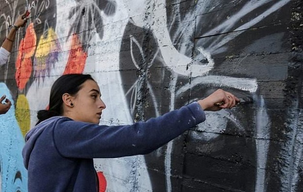 Suha Sultan, a 20-year-old graffiti artist, has sometimes experienced suspicion and hostility over her work. PHOTO: AFP