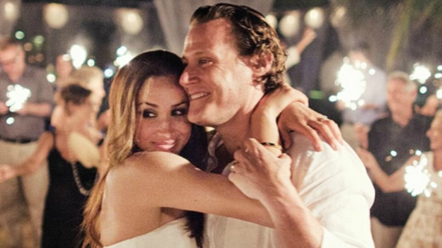 Meghan and Trevor Engelson celebrate their 2011 wedding in Jamaica. Their busy demanding careers led to their break-up after two years. PHOTO: DAILY MAIL