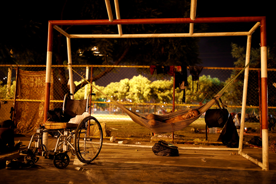 Men sleep in a sport centre where a community of homeless Venezuelan migrants stays, in Cucuta, Colombia. PHOTO: REUTERS