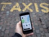 file-photo-a-photo-illustration-shows-the-uber-app-on-a-mobile-telephone-as-it-is-held-up-for-a-posed-photograph-in-london