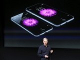 file-photo-apple-ceo-tim-cook-stands-in-front-of-a-screen-displaying-the-iphone-6-during-a-presentation-at-apple-headquarters-in-cupertino-2