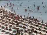 tourists-crowd-palma-de-mallorcas-arenal-beach-on-the-spanish-balearic-island-of-mallorca