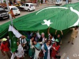 supporters-of-civil-rights-group-for-transgender-people-the-gender-interactive-alliance-gia-dance-and-chant-slogans-as-they-pose-with-a-national-flag-ahead-of-the-independence-day-in-karachi-paki-2