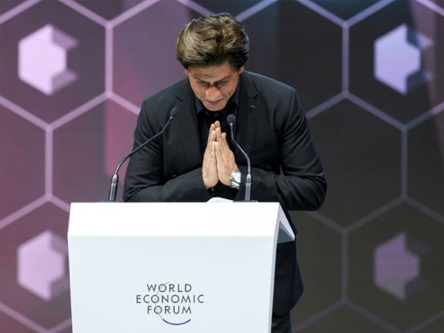 Bollywood actor Shah Rukh Khan after receiving an award in Davos for charitable work for victims of acide attacks PHOTO: AFP