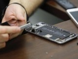 a-worker-checks-an-iphone-in-a-repair-store-in-new-york-2