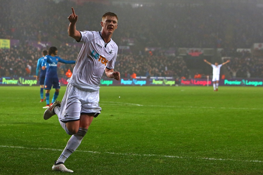 swansea city 039 s english midfielder sam clucas celebrates scoring their first goal during the english premier league football match between swansea city and arsenal at the liberty stadium in swansea south wales on january 30 2018 photo afp