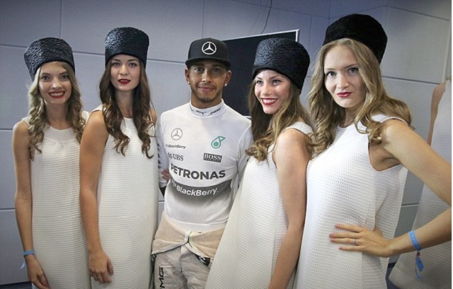 mercedes amg petronas driver lewis hamilton poses with grid girls in sochi in october 2015 photo afp