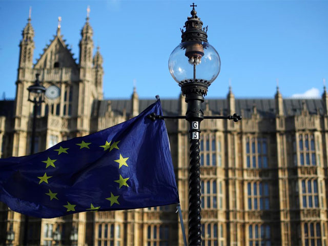 a european union flag flies from a lamp post opposite the houses of parliament in london britain photo reuters file