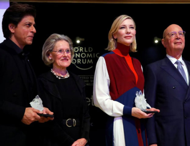 Actor Cate Blanchett and actor Shah Rukh Khan pose for the media after receiving the Crystal Awards, with Hilde Schwab, Chairperson and Co-Founder, Schwab Foundation for Social Entrepreneurship and Klaus Schwab, Founder and Executive Chairman of the WEF, at the annual meeting of the World Economic Forum (WEF) in Davos, Switzerland January 22, 2018. REUTERS/Denis Balibouse 