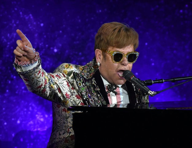 Pop legend Elton John performs two songs before announcing at a New York press conference that he is retiring from touring PHOTO: AFP