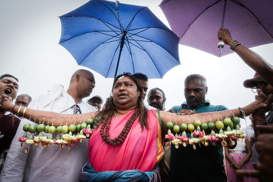 A Hindu devotee gets her body hooked with spikes, lime, coconuts,fruits and flowers during the annual Hindu Thaipoosam Kavady festival in Mount Edgecombe township, Durban. PHOTO: AFP