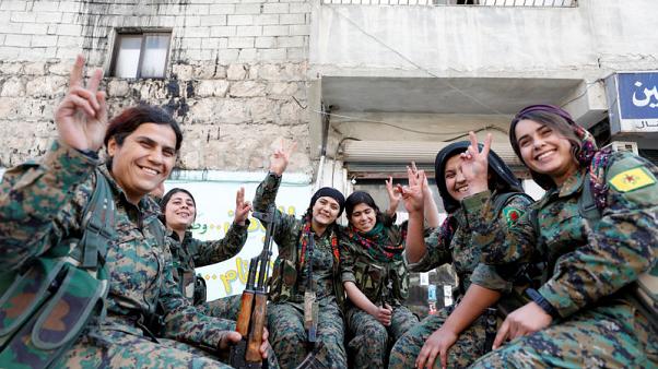 women fighters show victory signs PHOTO:REUTERS