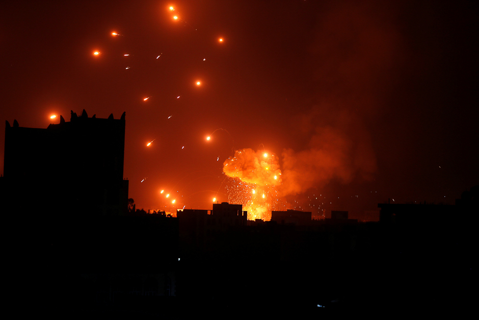 A Houthi arms depot explodes after it was hit by air strikes in Sanaa, Yemen. PHOTO: REUTERS